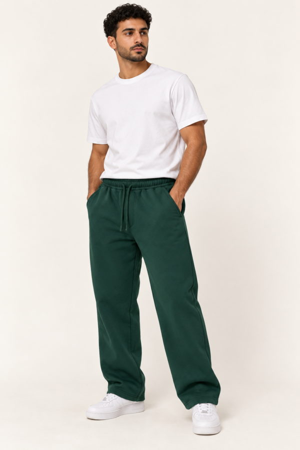 Male model wearing HODOOMY wood green unisex wide leg cotton sweatpants, front view